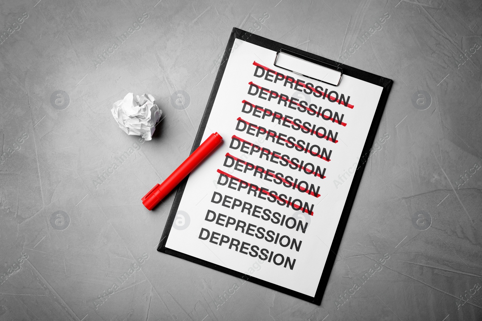Photo of Composition with clipboard and marker on gray background, top view. Depression symptoms