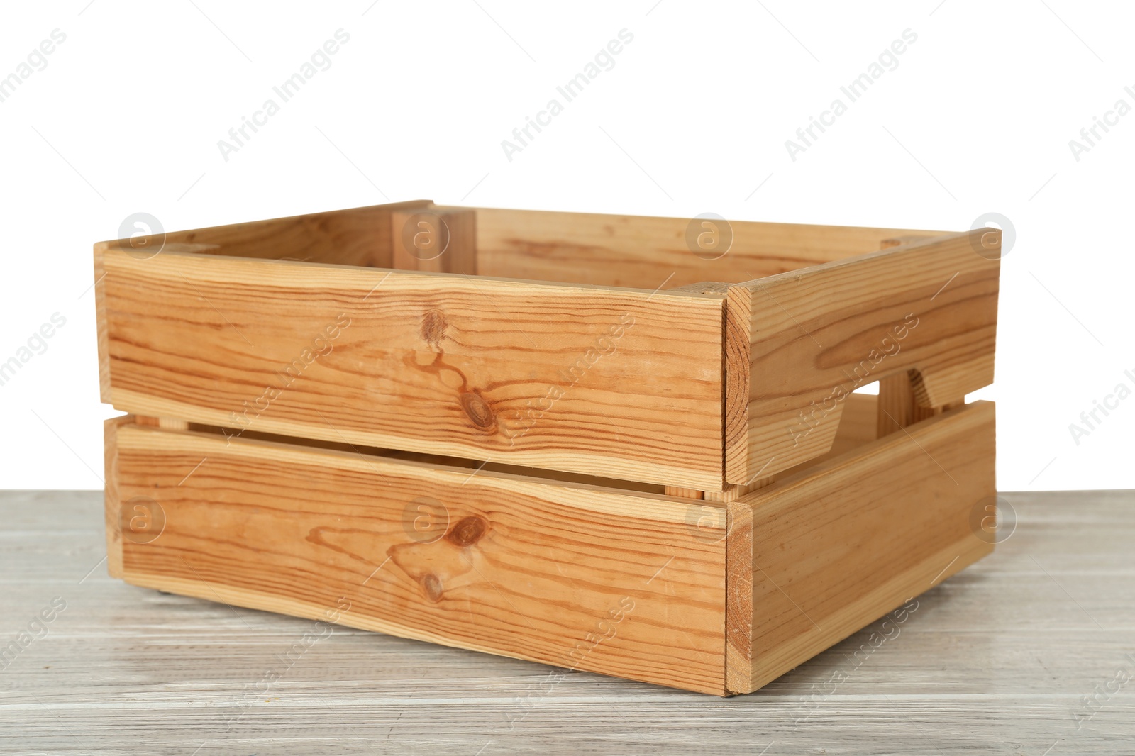 Photo of Empty rustic wooden crate on table against white background