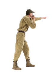 Male security guard using portable radio transmitter on white background