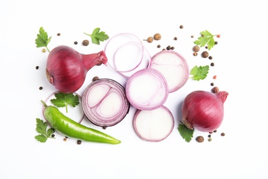 Beautiful composition with ripe red onions on white background