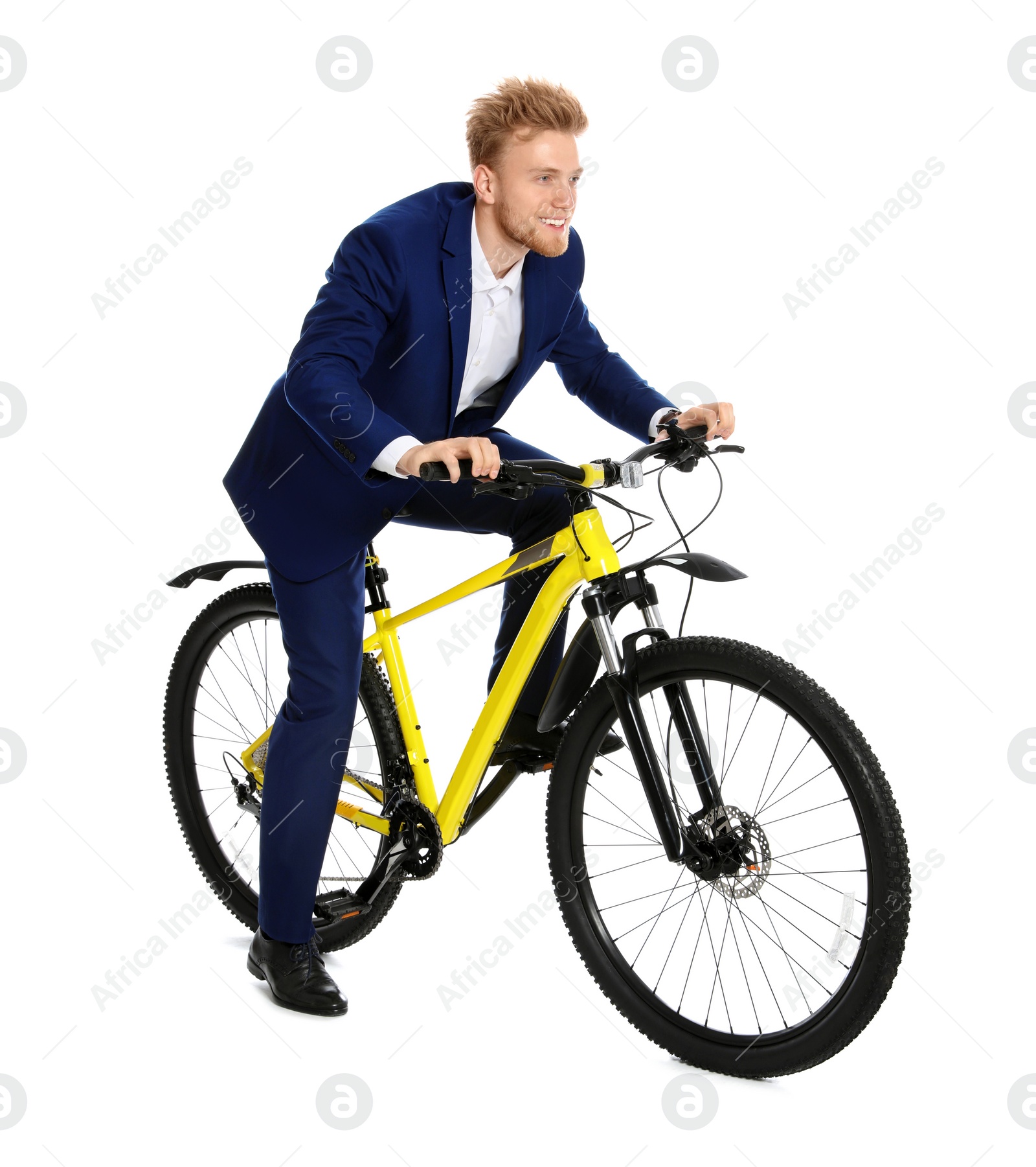 Photo of Young businessman riding bicycle on white background