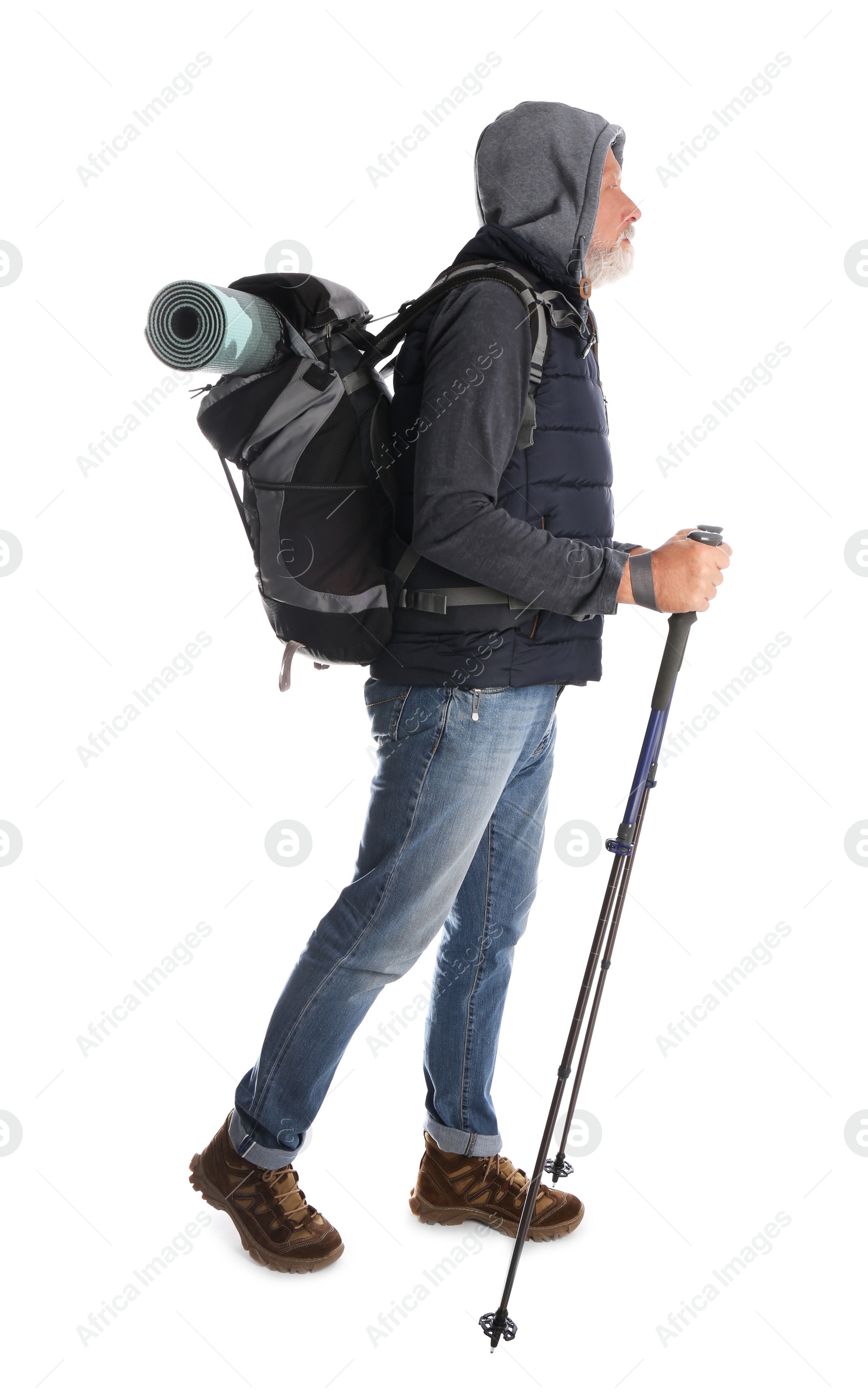 Photo of Male hiker with backpack and trekking poles on white background