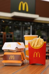 Lviv, Ukraine - October 9, 2023: McDonald's menu on wooden table outdoors