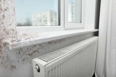 Image of Window sill and slope affected with mold in room