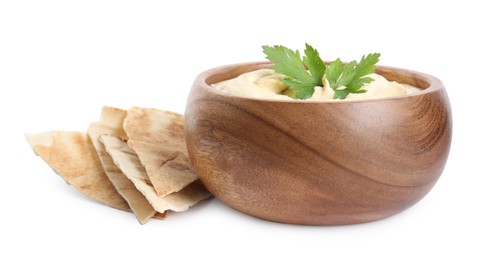 Photo of Delicious hummus with pita chips and parsley on white background
