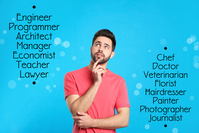 Image of Thoughtful young man choosing profession on light blue background