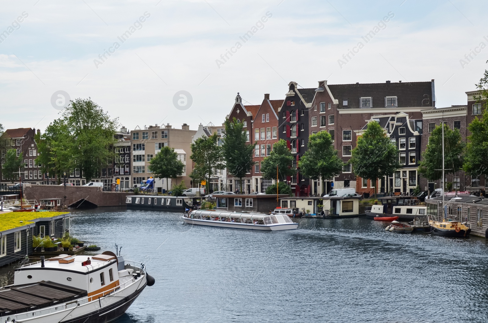 Photo of Picturesque view of town with beautiful buildings near river