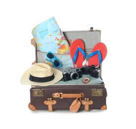 Photo of Open vintage suitcase with clothes and beach objects packed for summer vacation isolated on white
