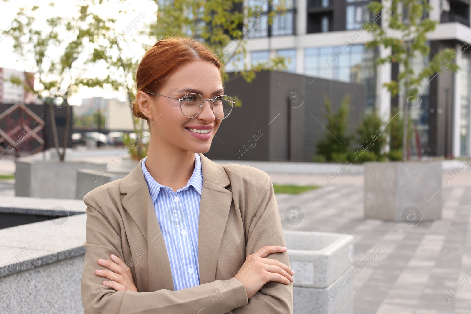 Photo of Portrait of beautiful woman in glasses outdoors, space for text