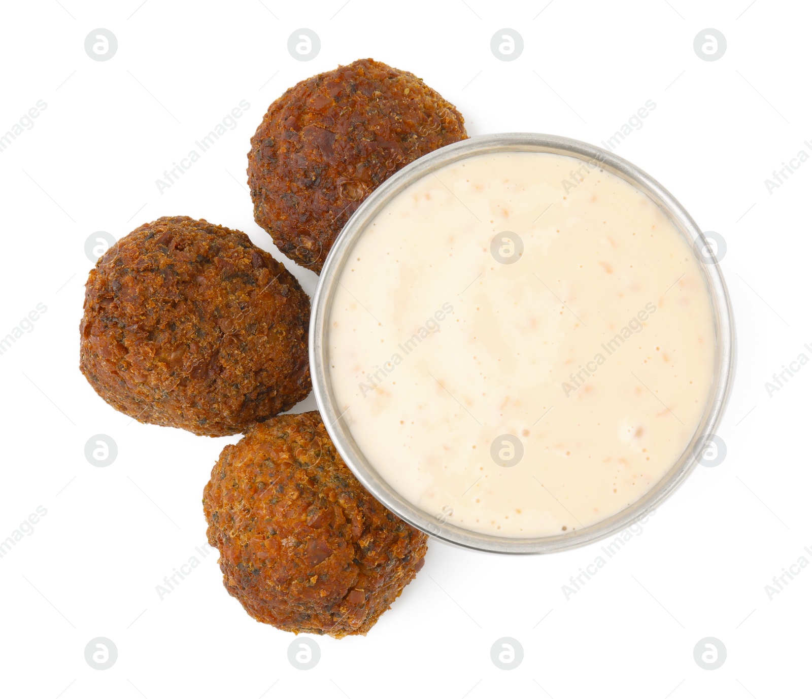 Photo of Delicious falafel balls and sauce isolated on white, top view