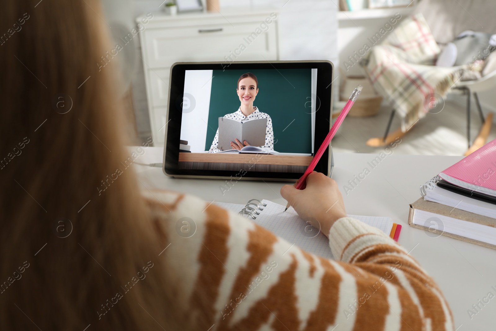 Image of Cute little girl with modern tablet at online lesson, closeup. E-learning