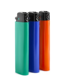 Stylish small pocket lighters on white background