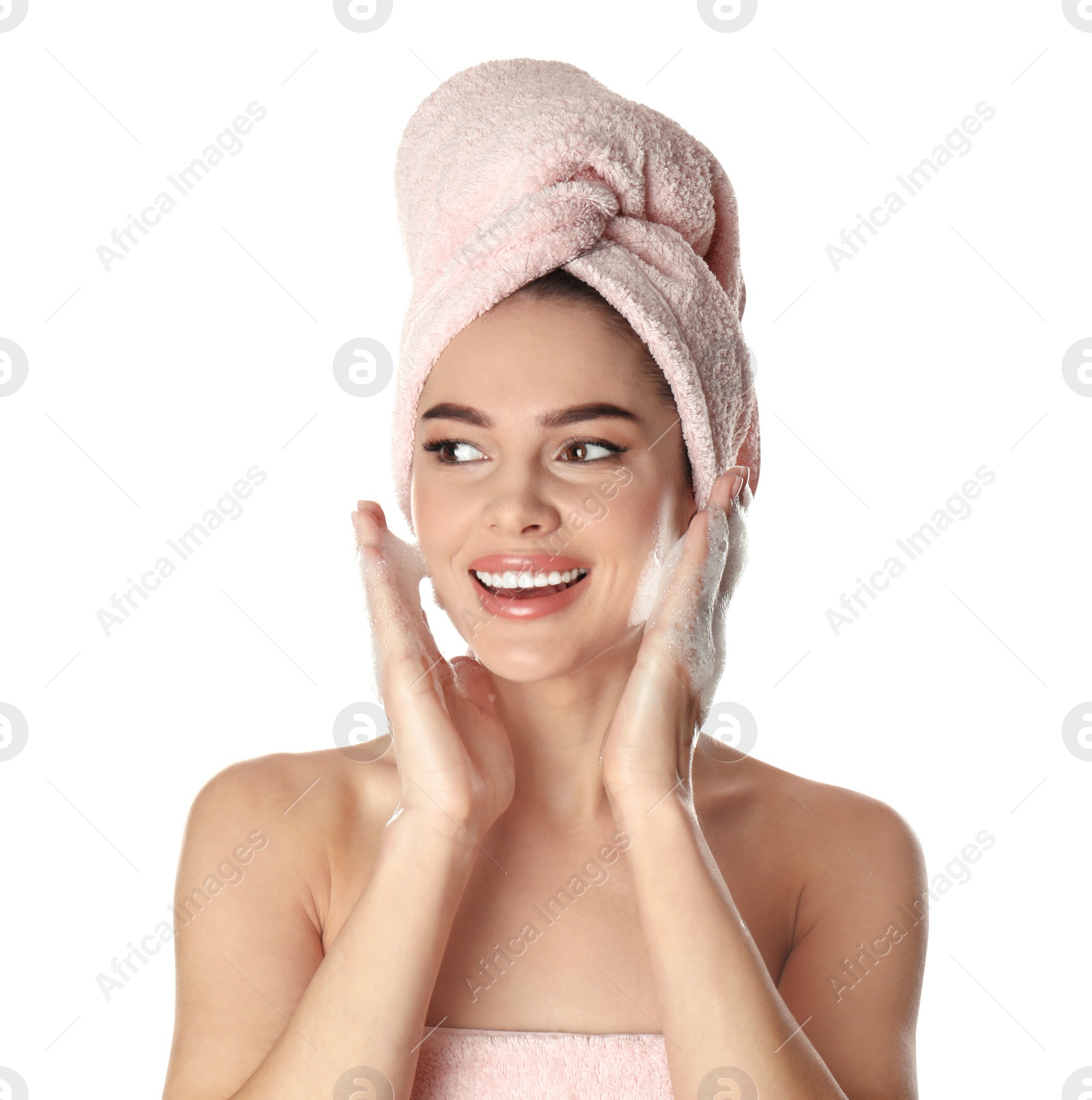 Photo of Young woman washing face with soap on white background