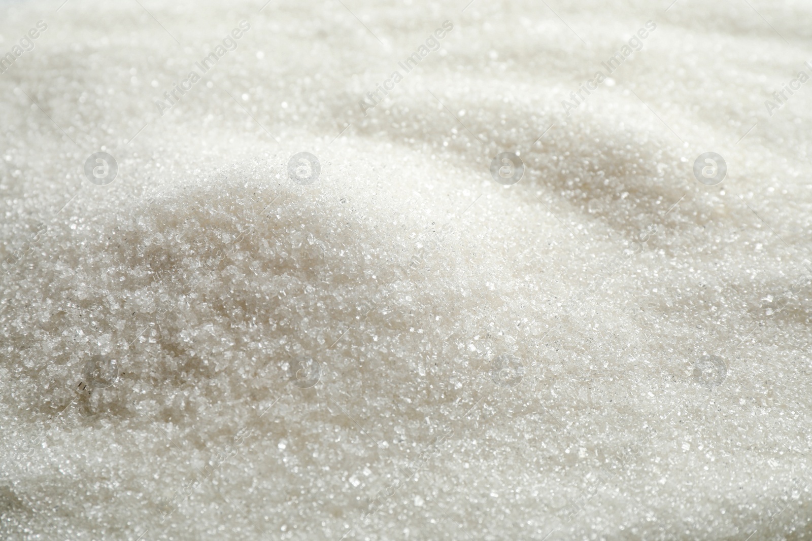 Photo of Pile of granulated sugar as background, closeup