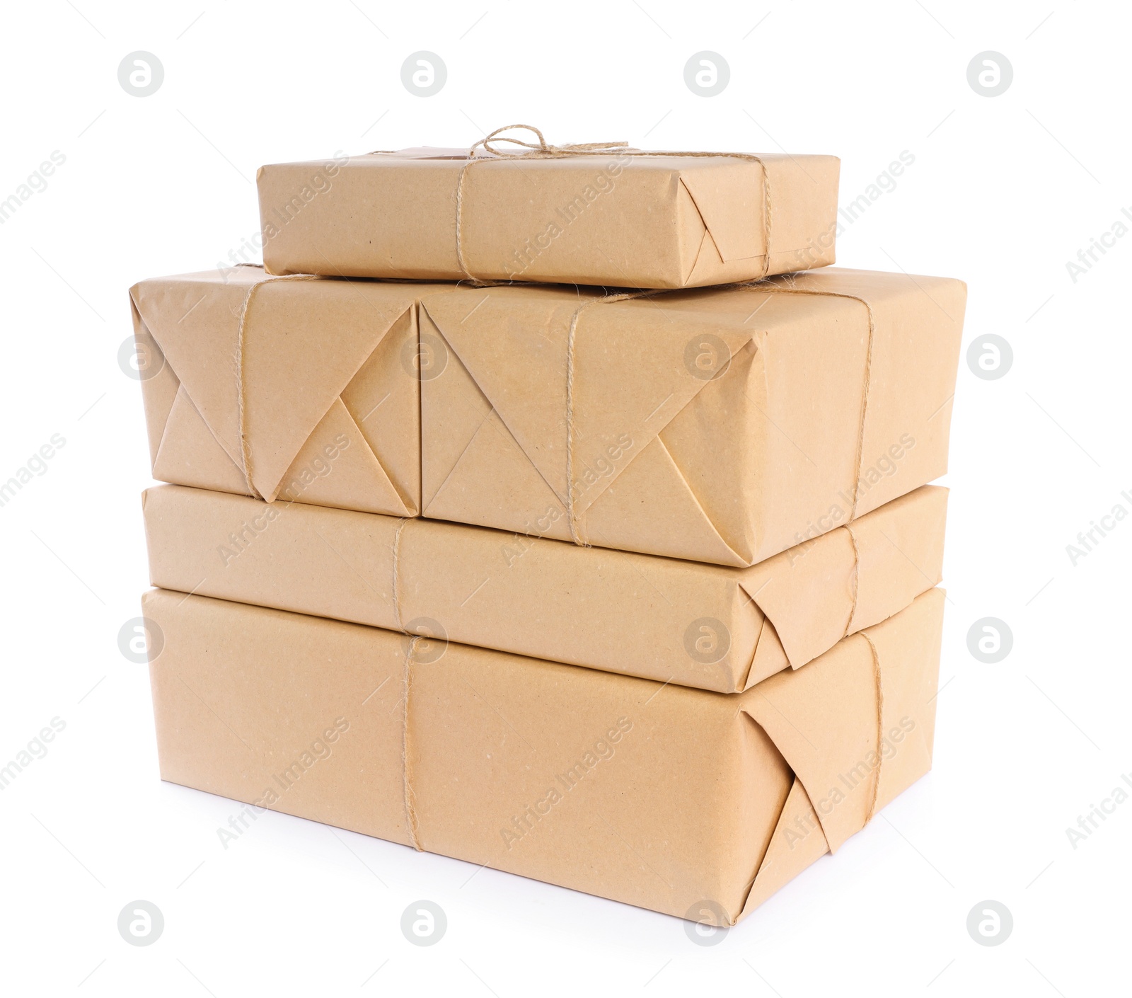 Photo of Stacked parcels wrapped in kraft paper on white background