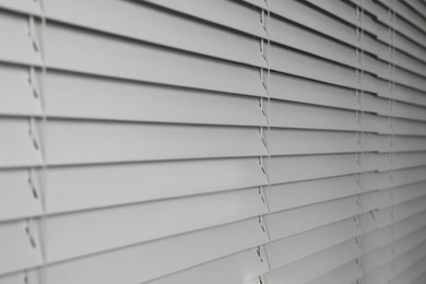 Closeup view of horizontal blinds on window indoors