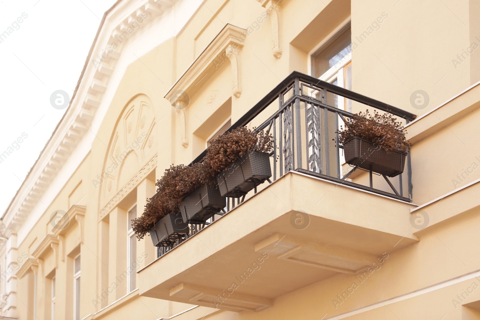 Photo of Beautiful view of building with balcony. Exterior design