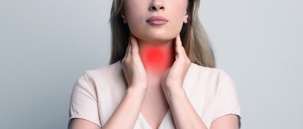 Endocrine system. Woman doing thyroid self examination on grey background, closeup. Banner design