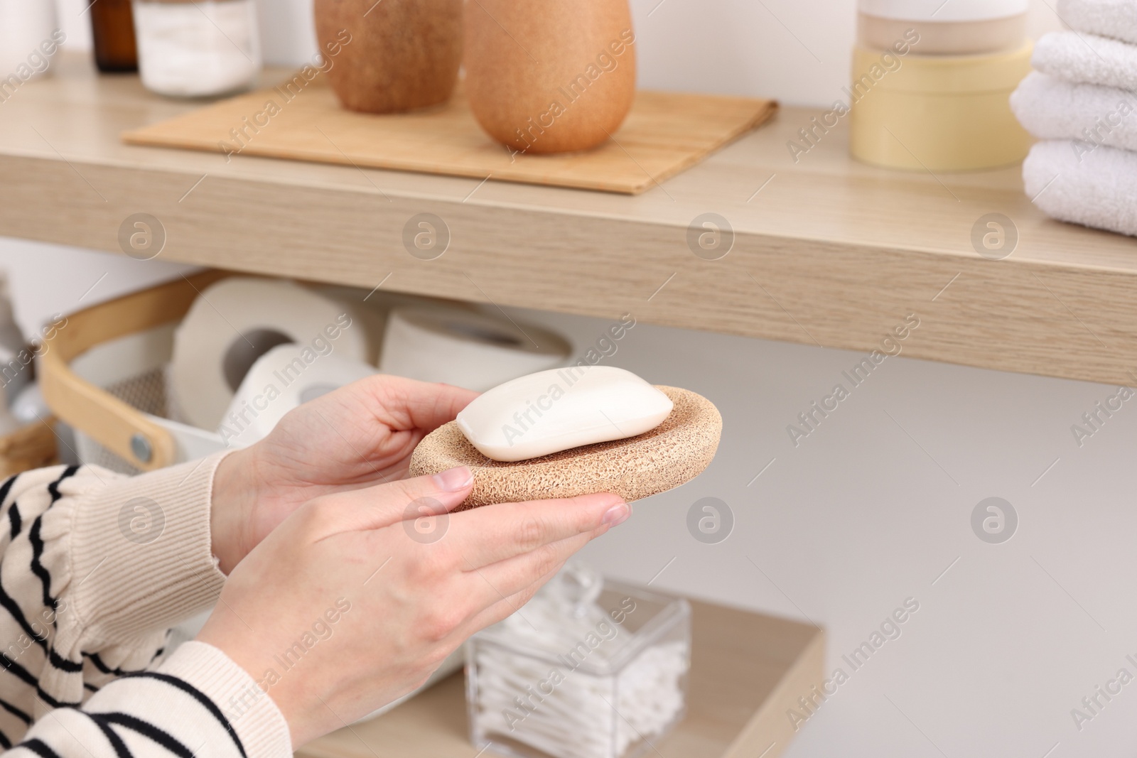 Photo of Bath accessories. Woman with soap indoors, closeup and space for text