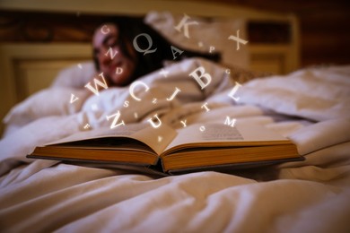 Image of Woman sleeping in bed at home, focus on open book with letters flying over it