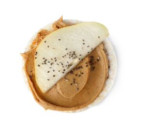 Photo of Puffed rice cake with peanut butter and pear isolated on white, top view