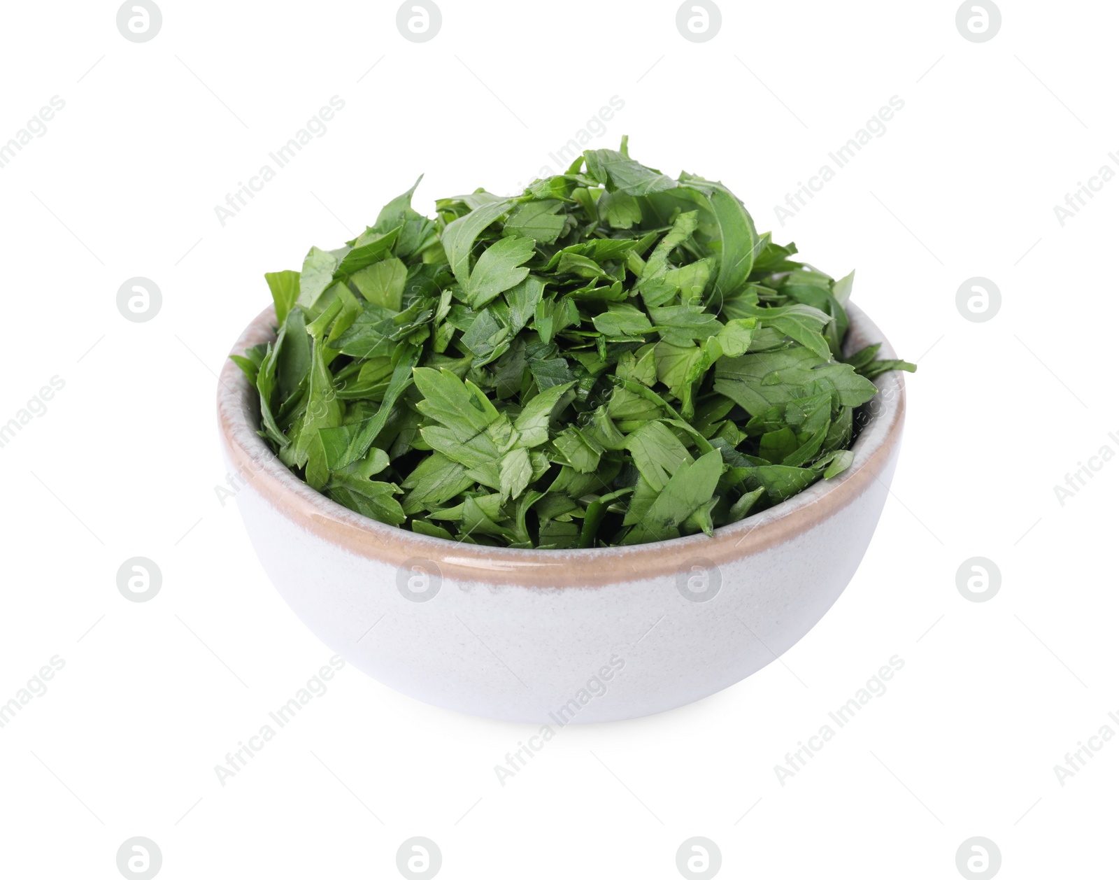 Chopped parsley leaves in bowl isolated on white Photo of Chopped parsley leaves in bowl isolated on white