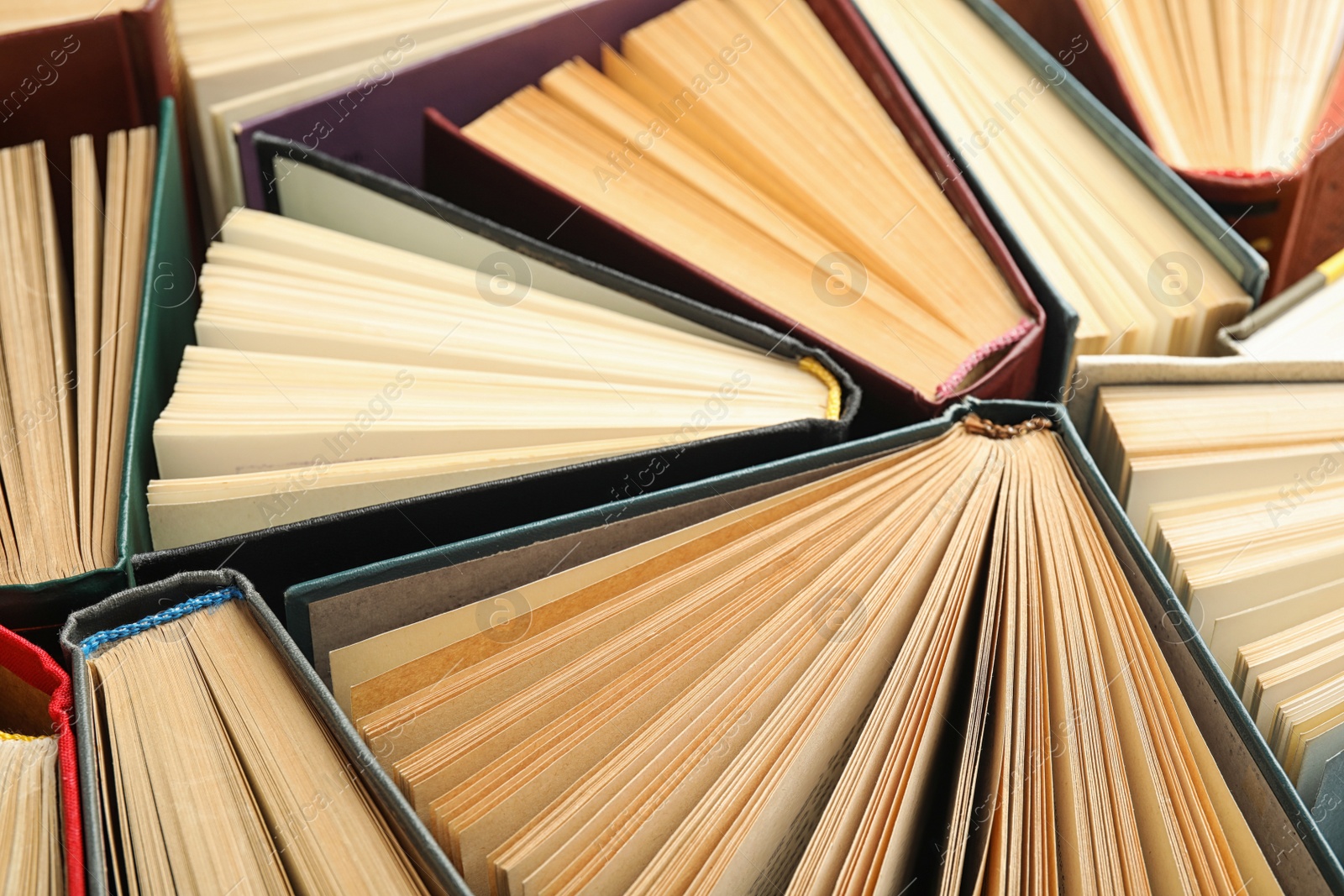 Photo of Many different hardcover books as background, closeup