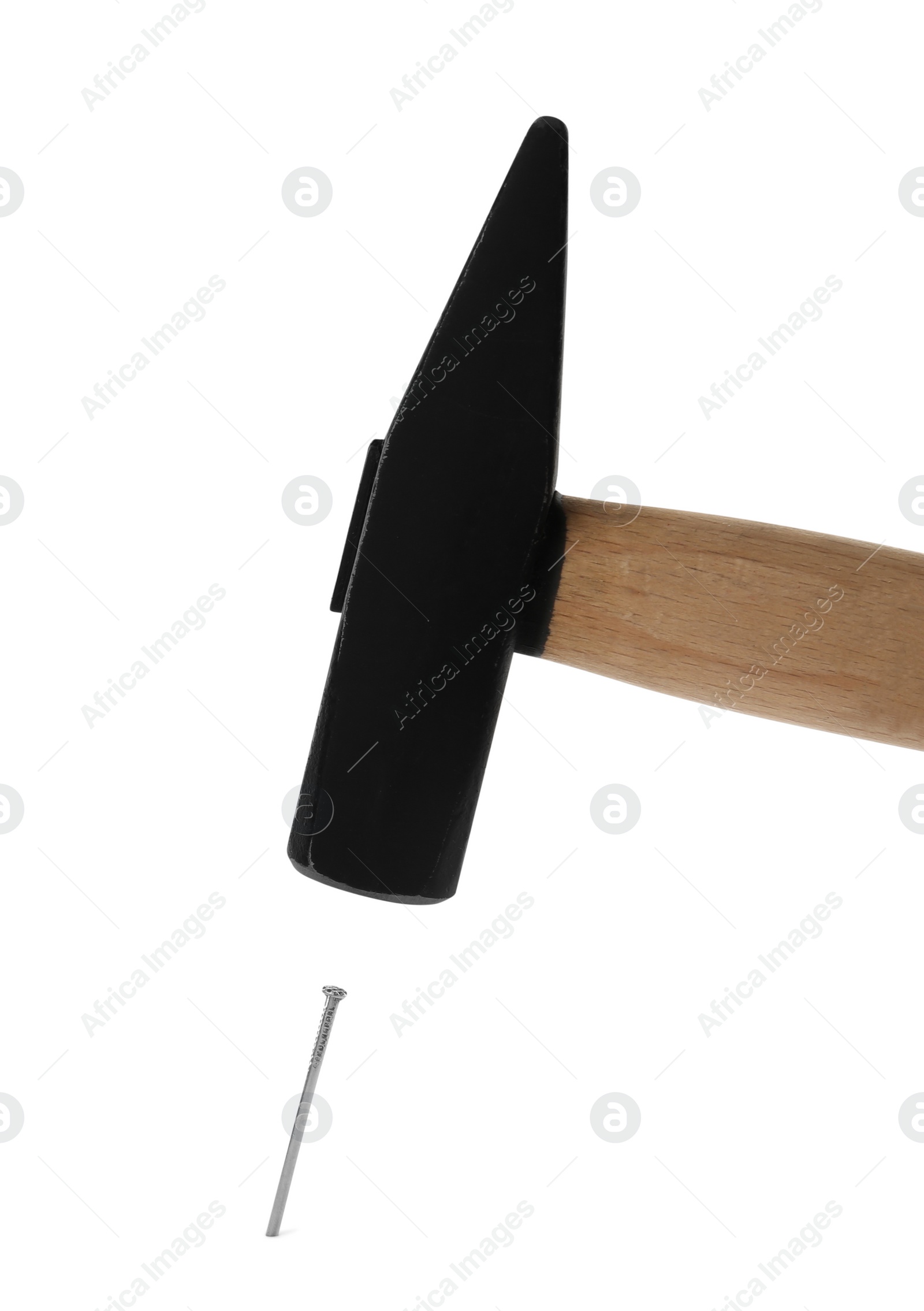 Photo of Hammer and metal nail on white background