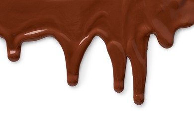 Photo of Tasty melted milk chocolate pouring down on white background