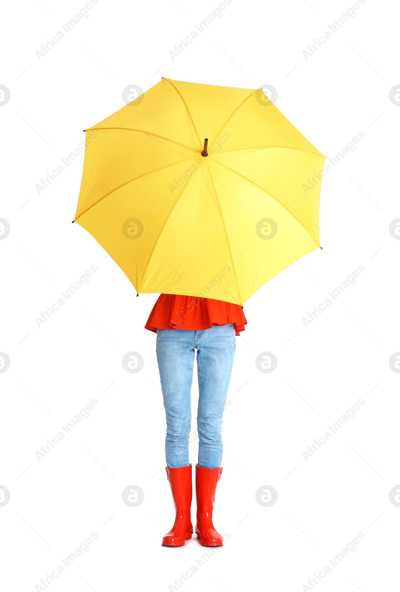 Photo of Woman hiding under yellow umbrella on white background