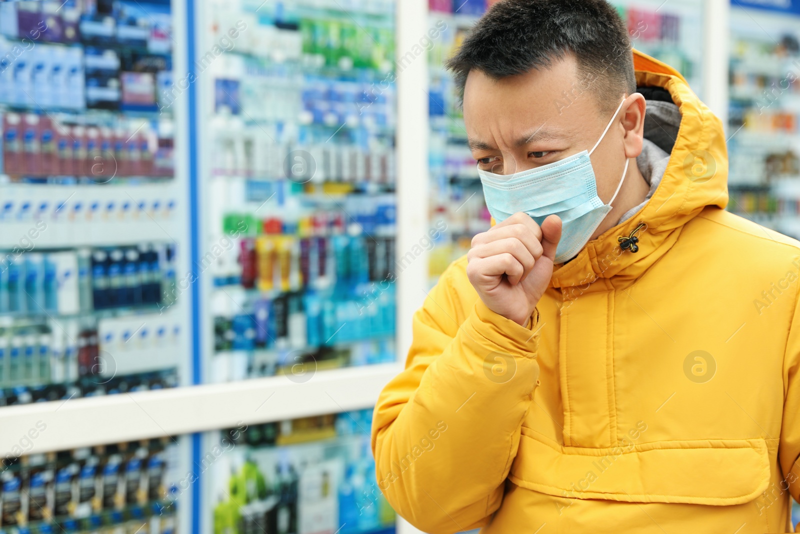 Photo of Asian man wearing medical mask on city street, space for text. Virus outbreak