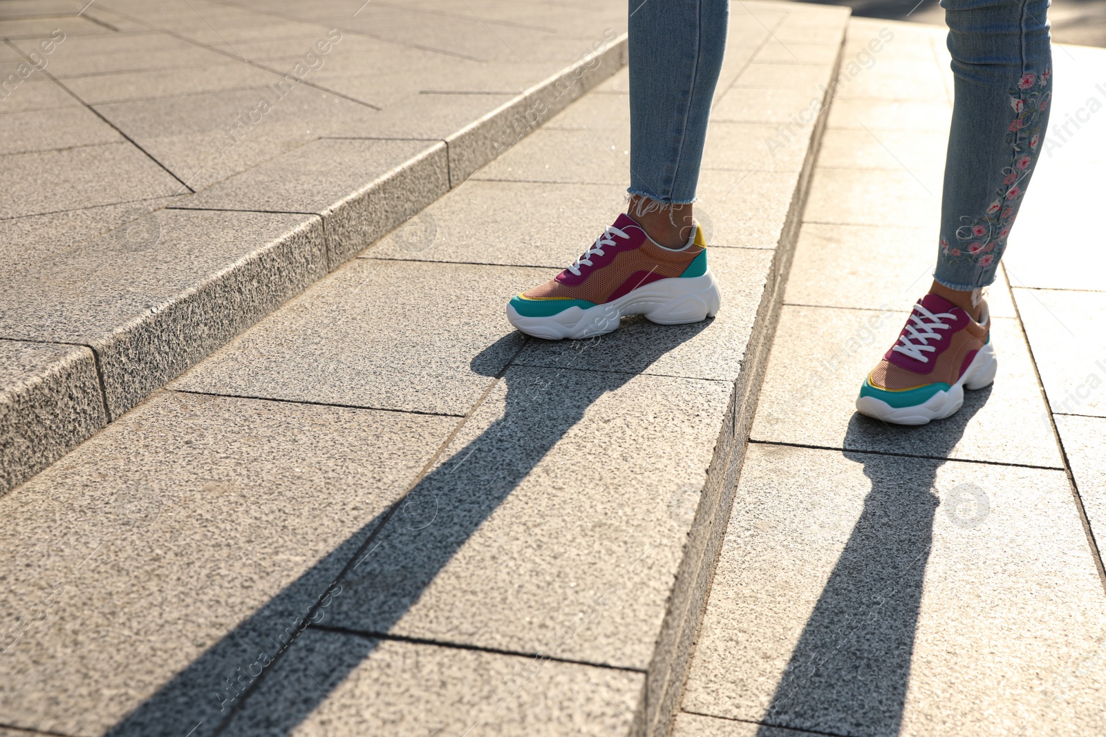 Photo of Woman on stairs outdoors, closeup with space for text. Choosing way concept.