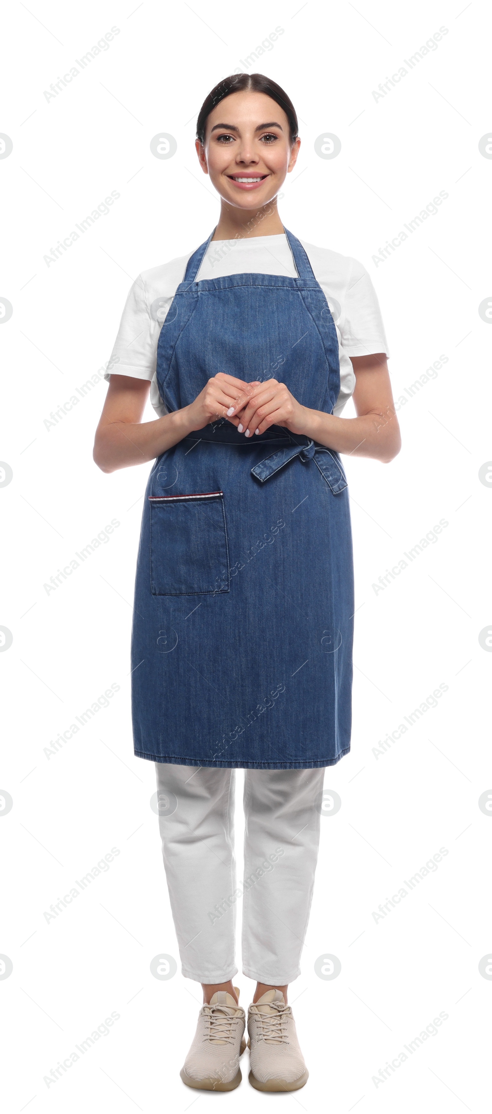 Photo of Young woman in blue jeans apron on white background