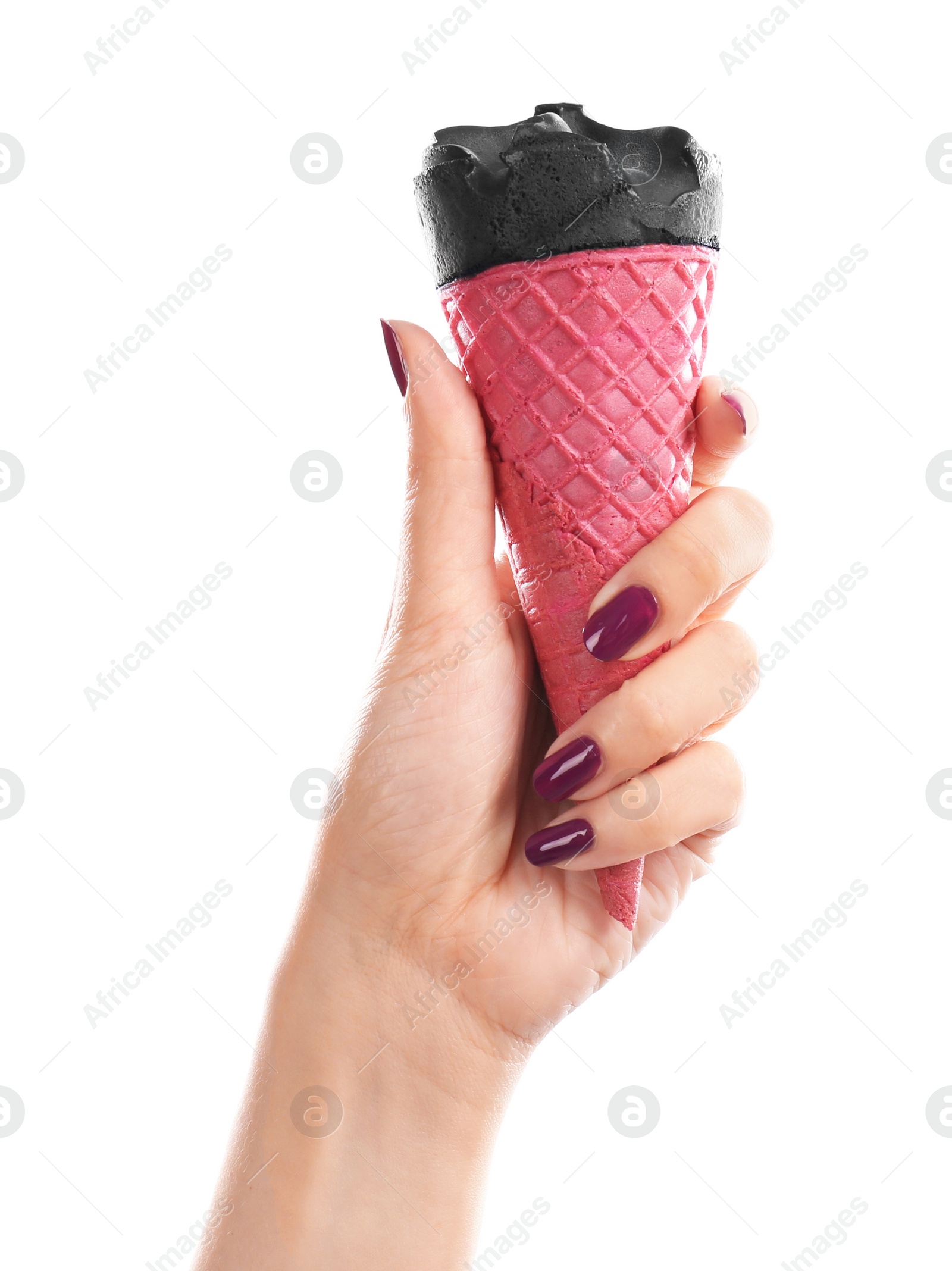 Photo of Woman holding yummy ice cream on white background. Focus on hand