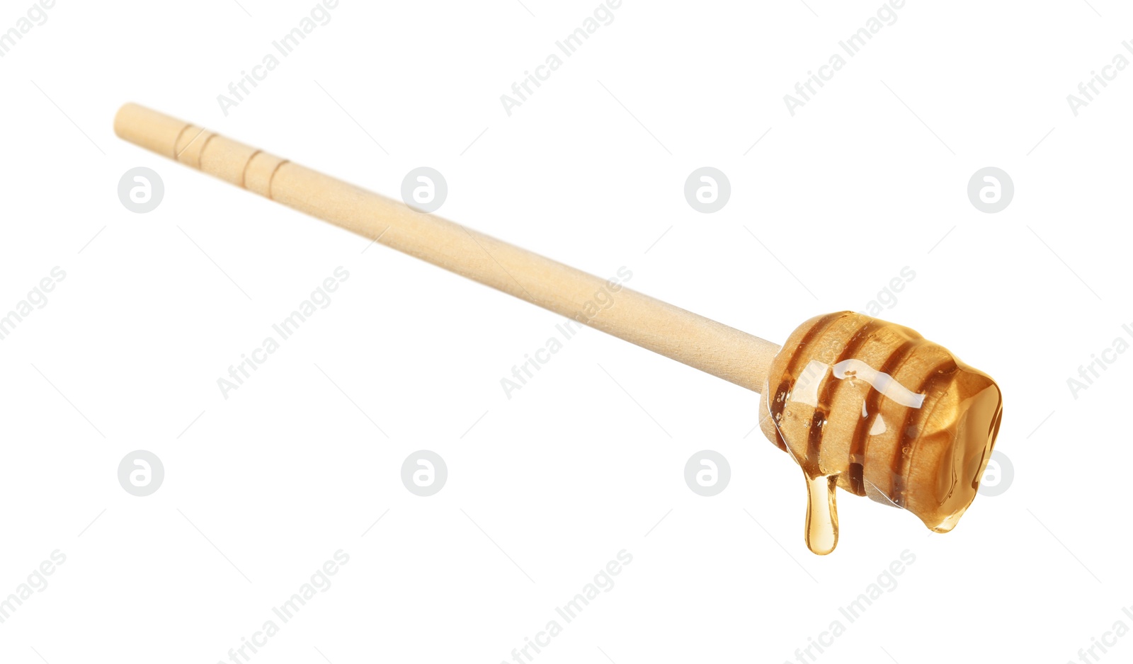 Photo of Natural honey dripping from dipper on white background