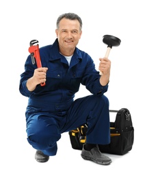 Photo of Mature plumber with pipe wrench and force cup on white background