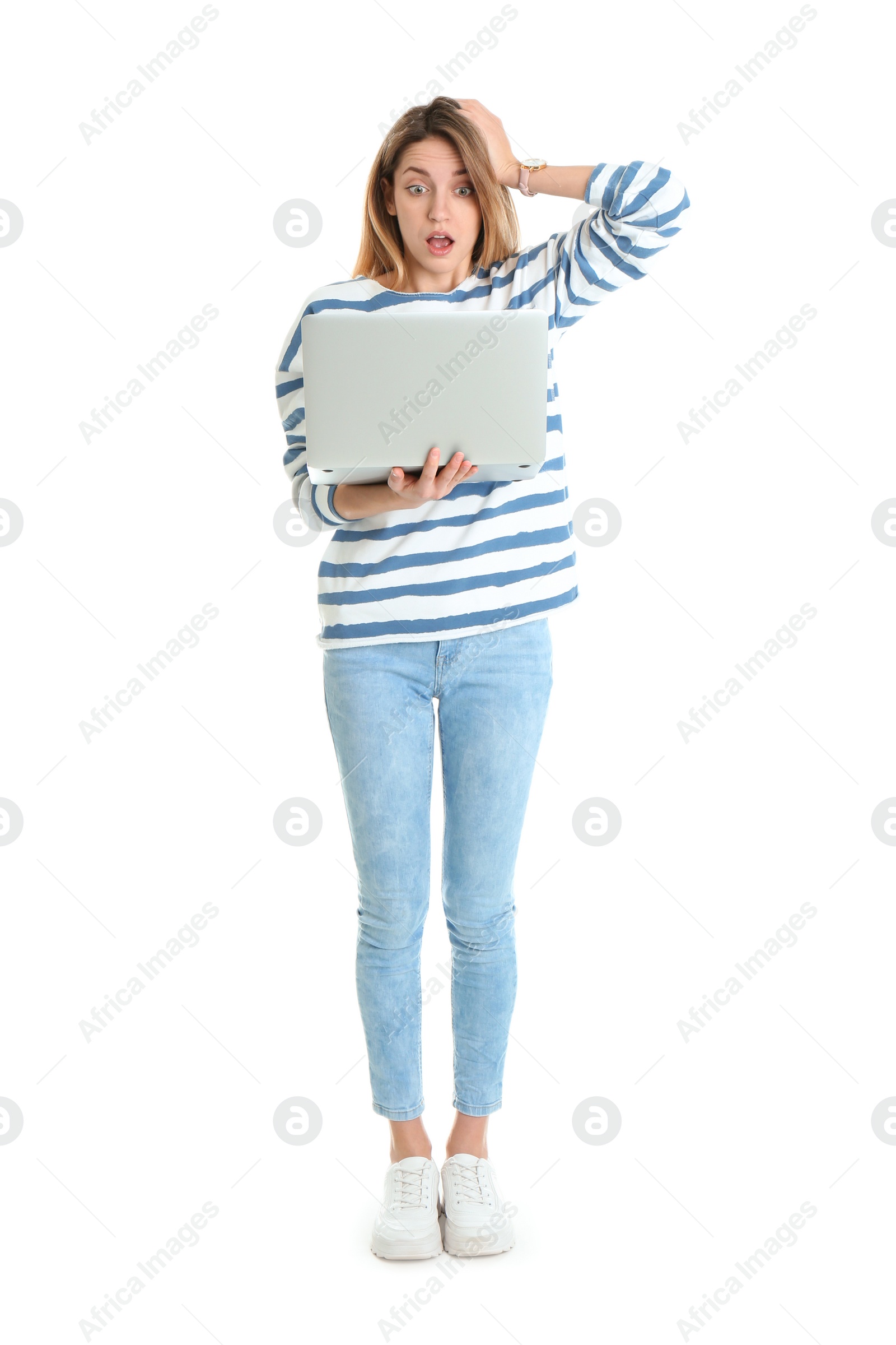 Photo of Full length portrait of shocked young woman in casual outfit with laptop on white background