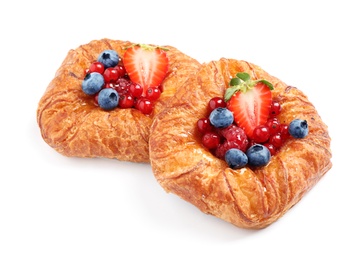 Fresh delicious puff pastry with sweet berries on white background