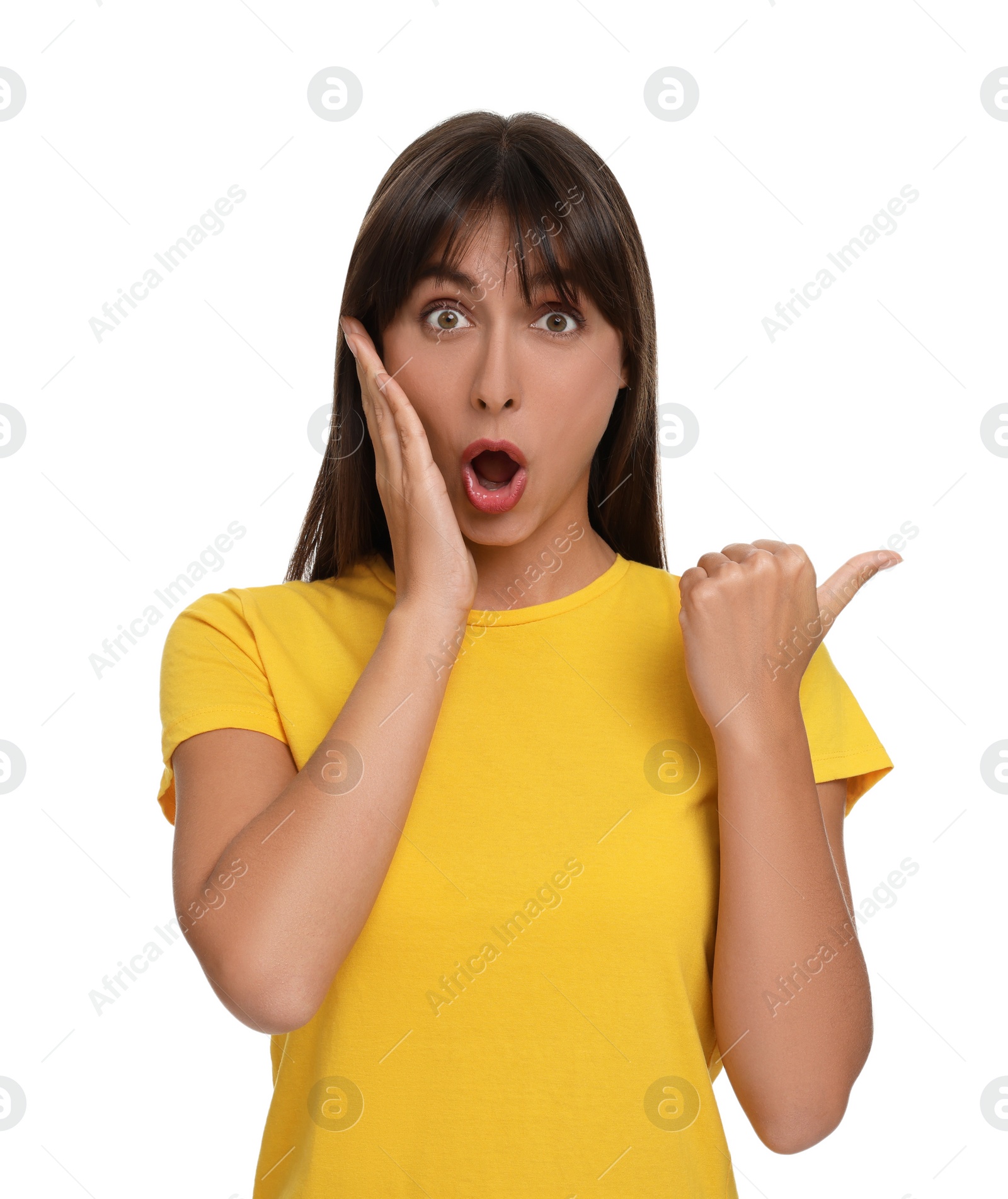 Photo of Special promotion. Surprised woman pointing at something on white background