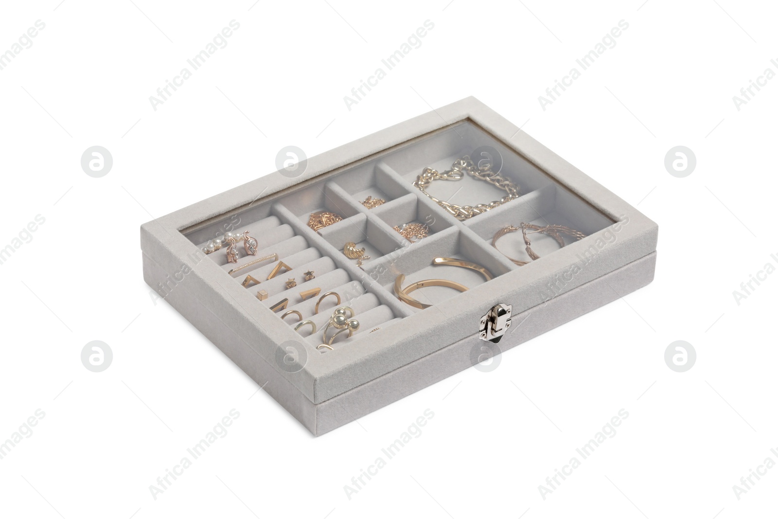 Photo of Jewelry box with many different golden accessories isolated on white