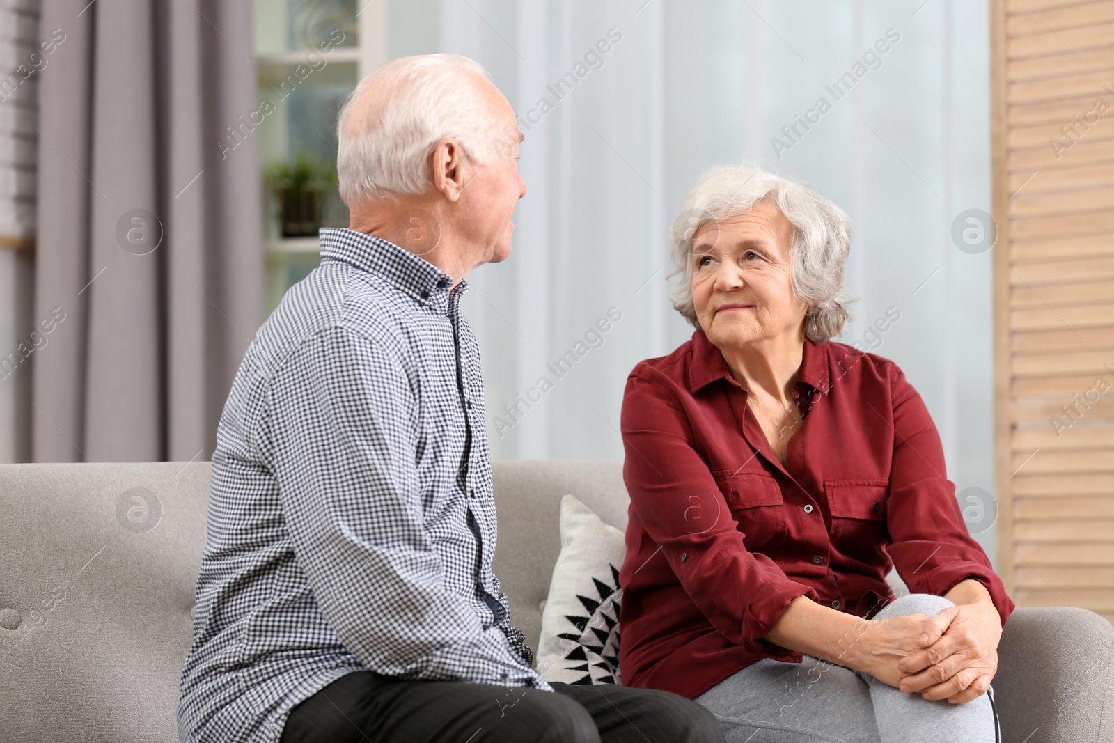 Photo of Portrait of elderly spouses in living room