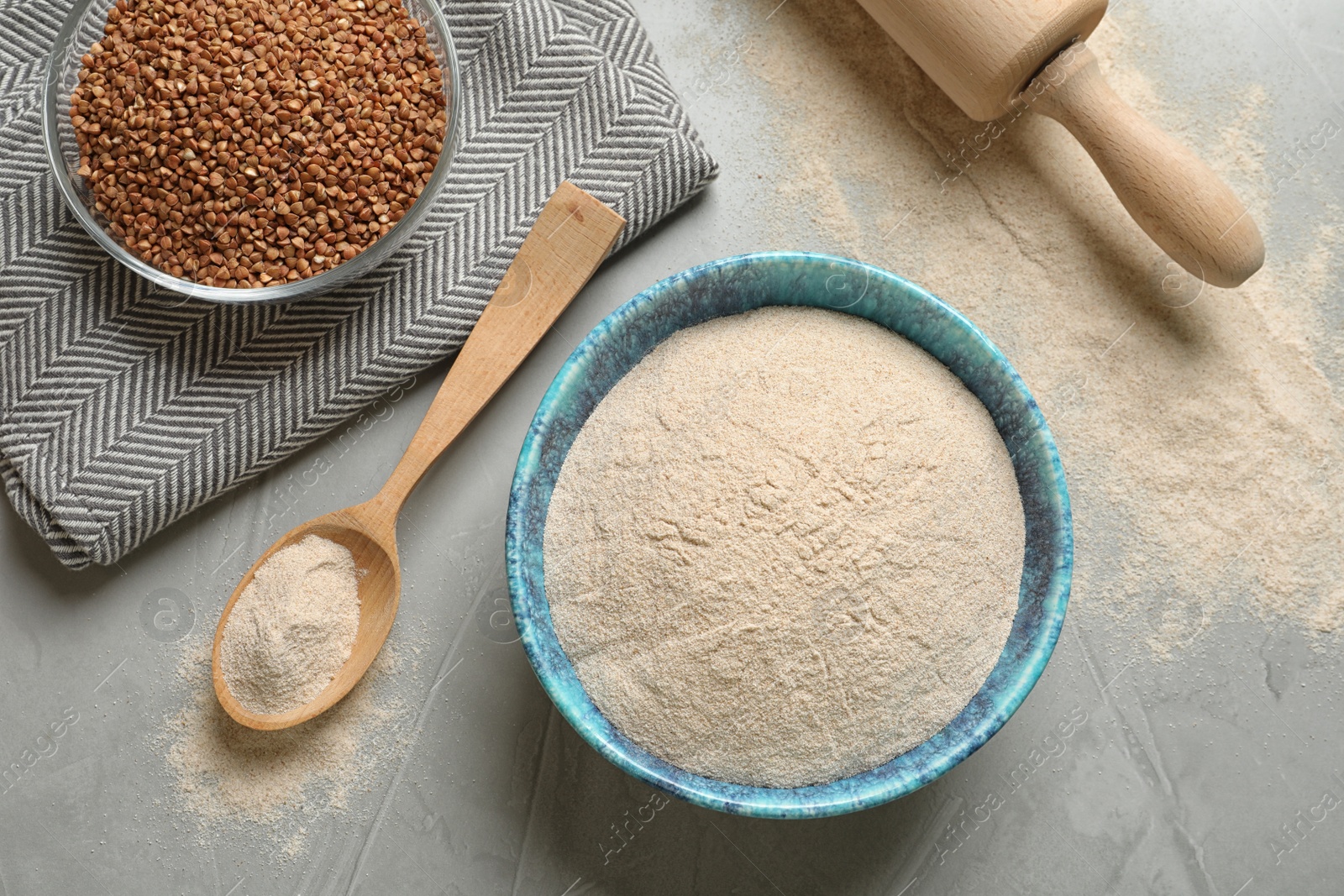 Image of Flat lay composition with buckwheat flour on grey table