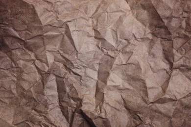 Texture of crumpled parchment paper as background, top view