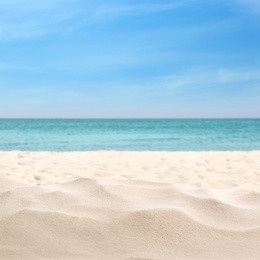 Beautiful beach with white sand near ocean, closeup view