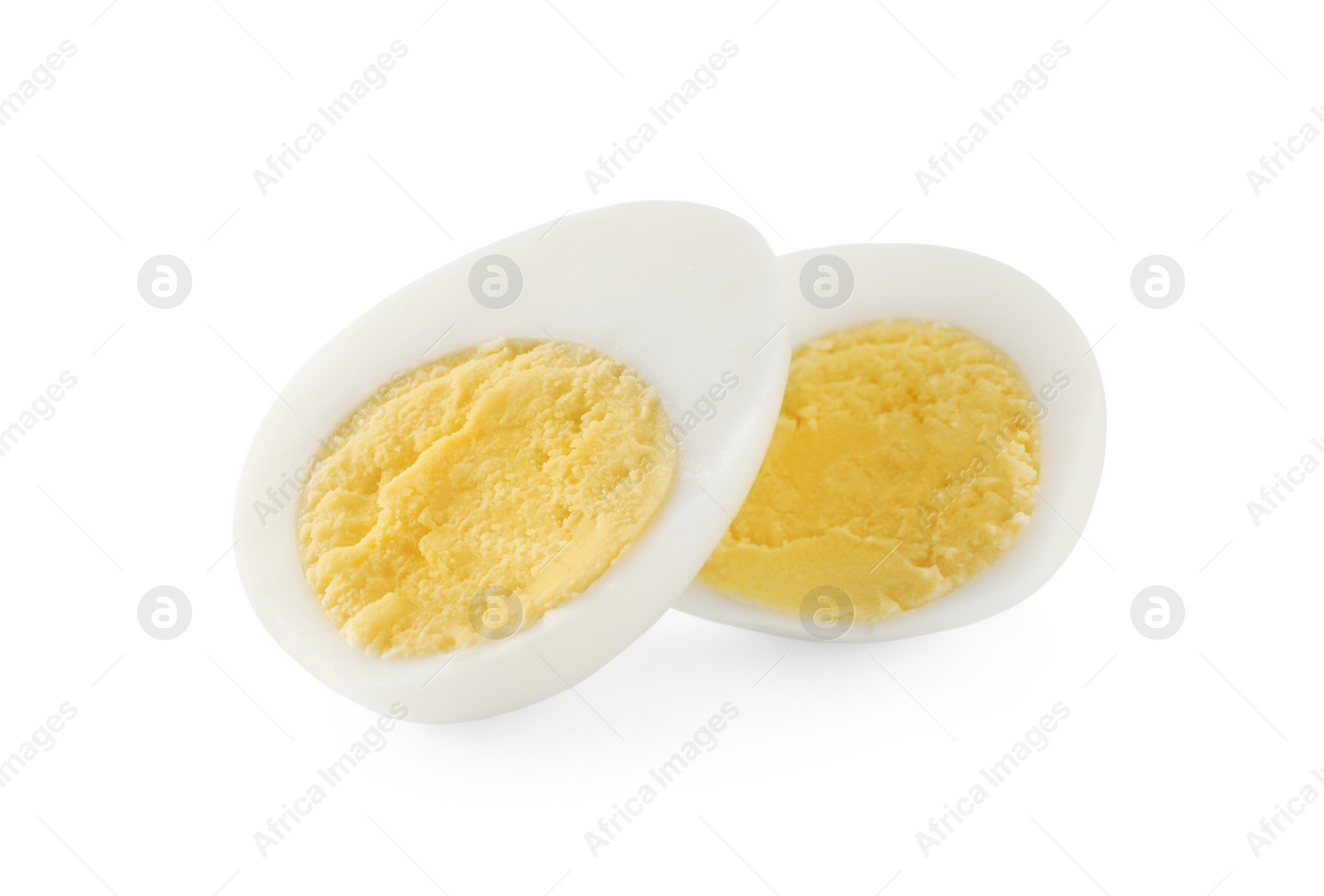 Photo of Halves of peeled hard boiled quail egg on white background