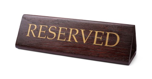 Photo of Elegant wooden Reserved table sign isolated on white
