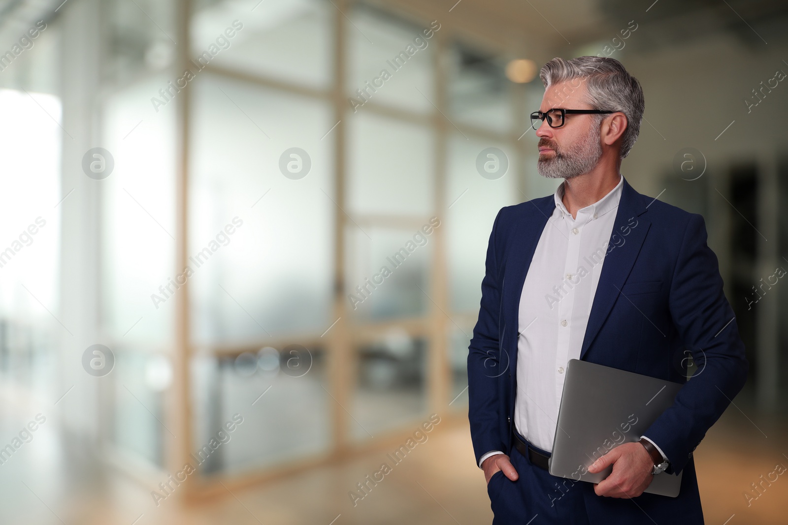 Image of Successful lawyer with laptop on blurred background, space for text