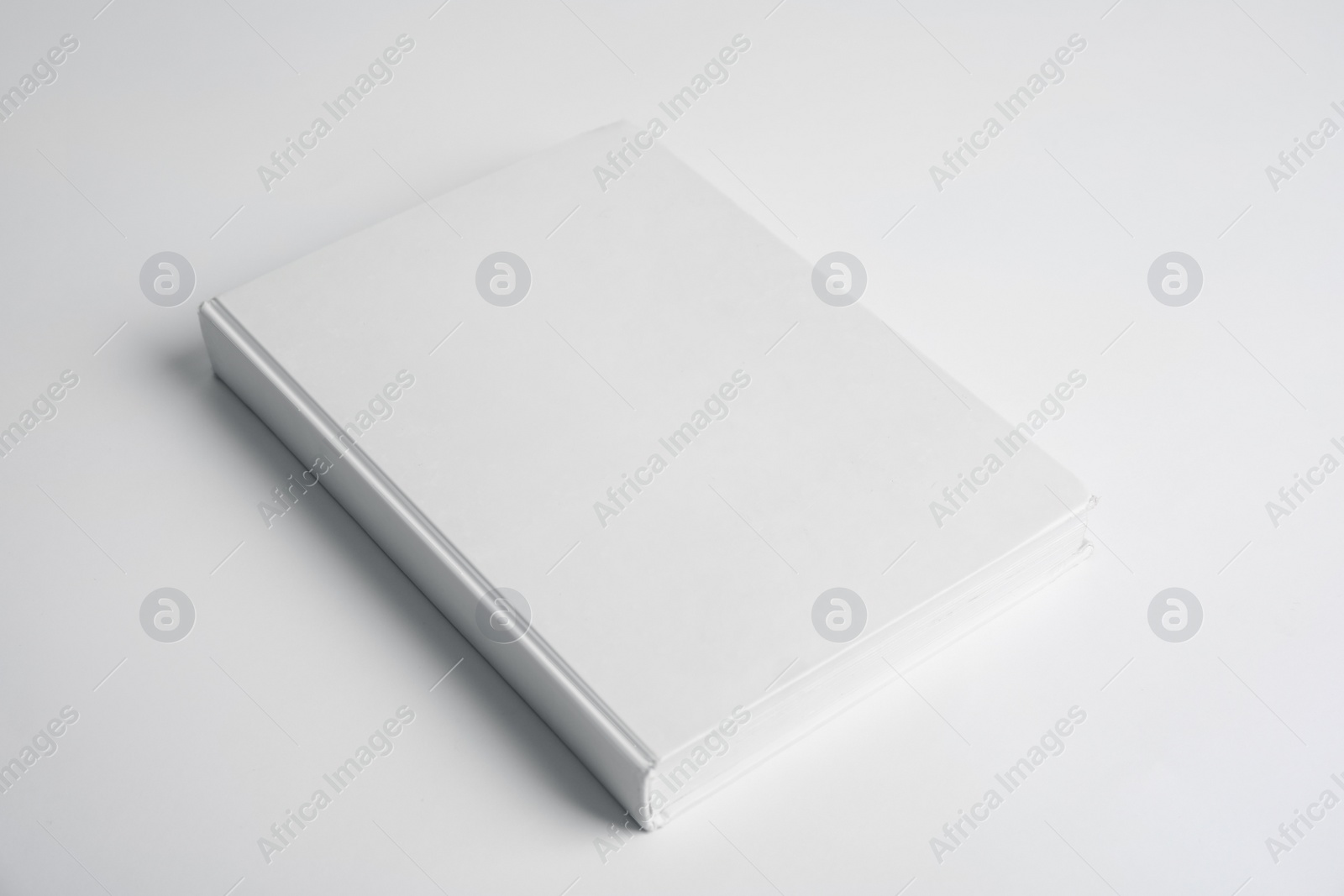 Photo of Book with blank cover on white background