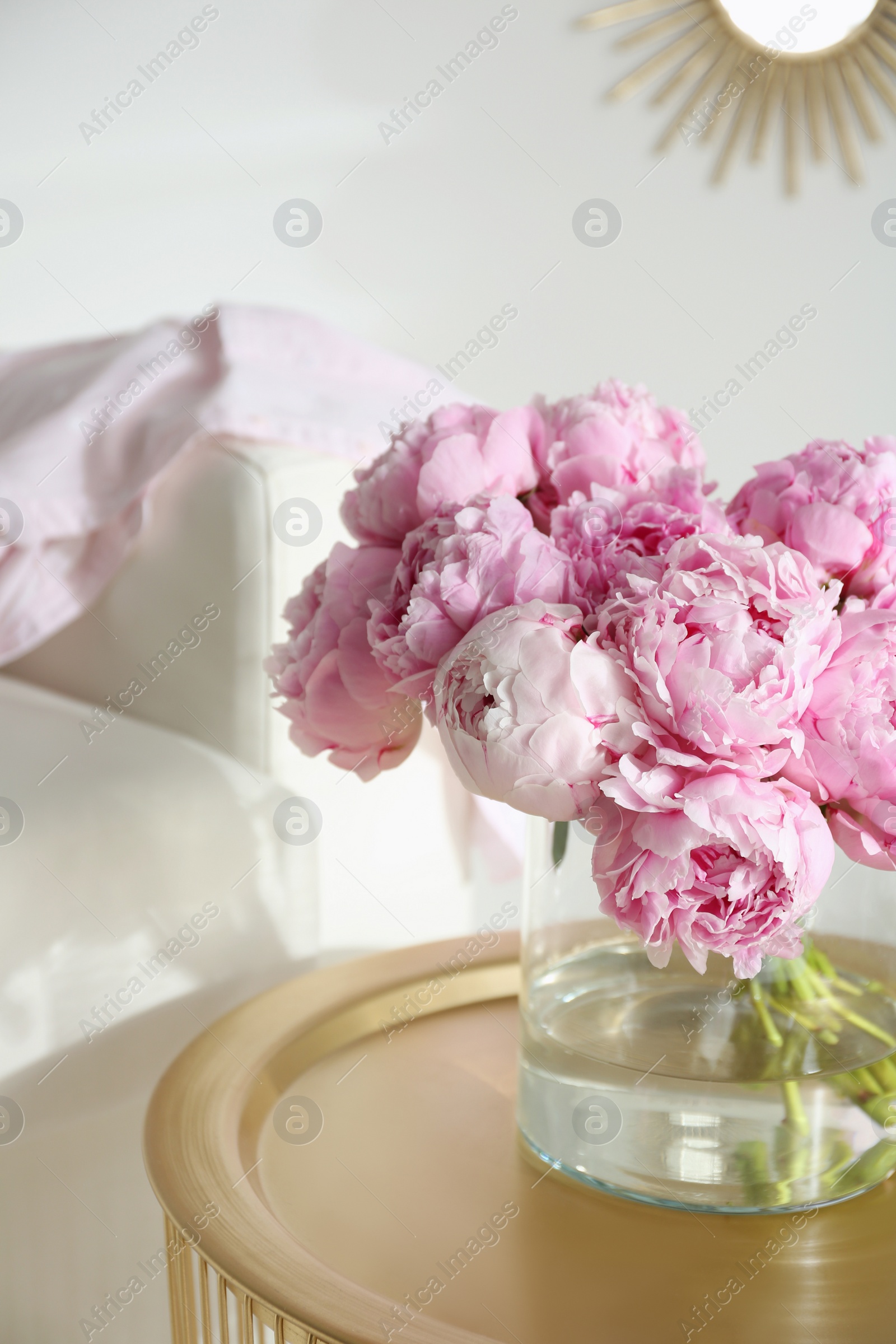 Photo of Bouquet of beautiful peonies on table indoors