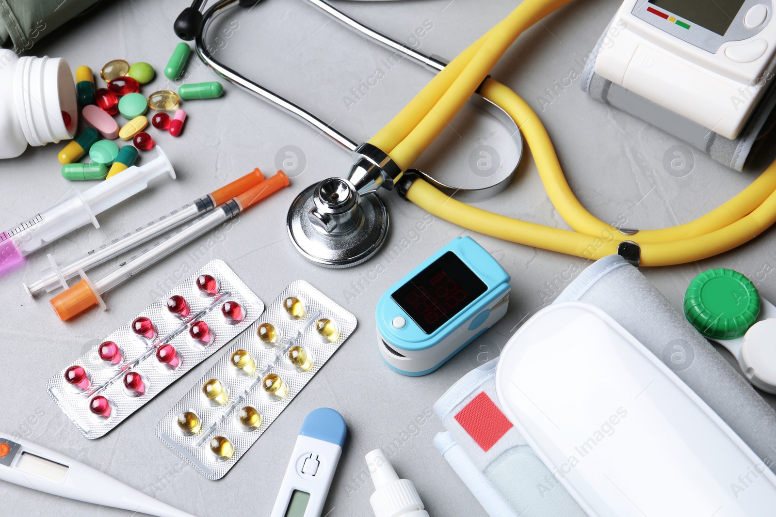 Photo of Set of medical objects on grey background, above view